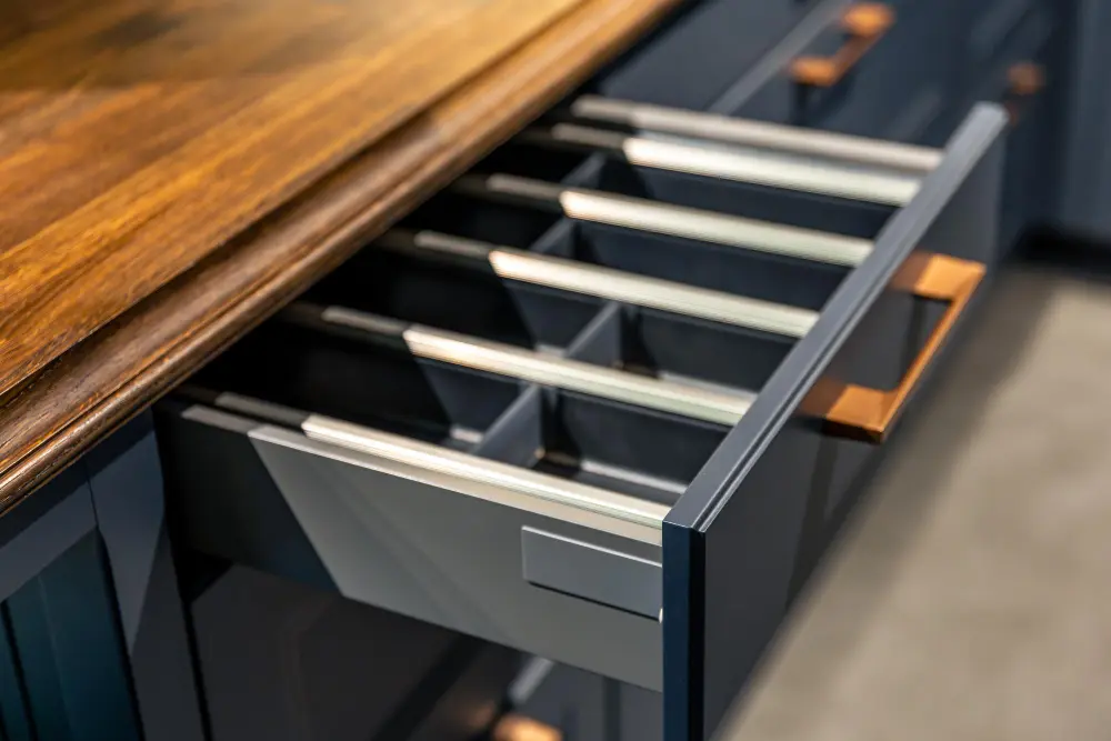 Modern kitchen drawer with metal runners and organised internal compartments