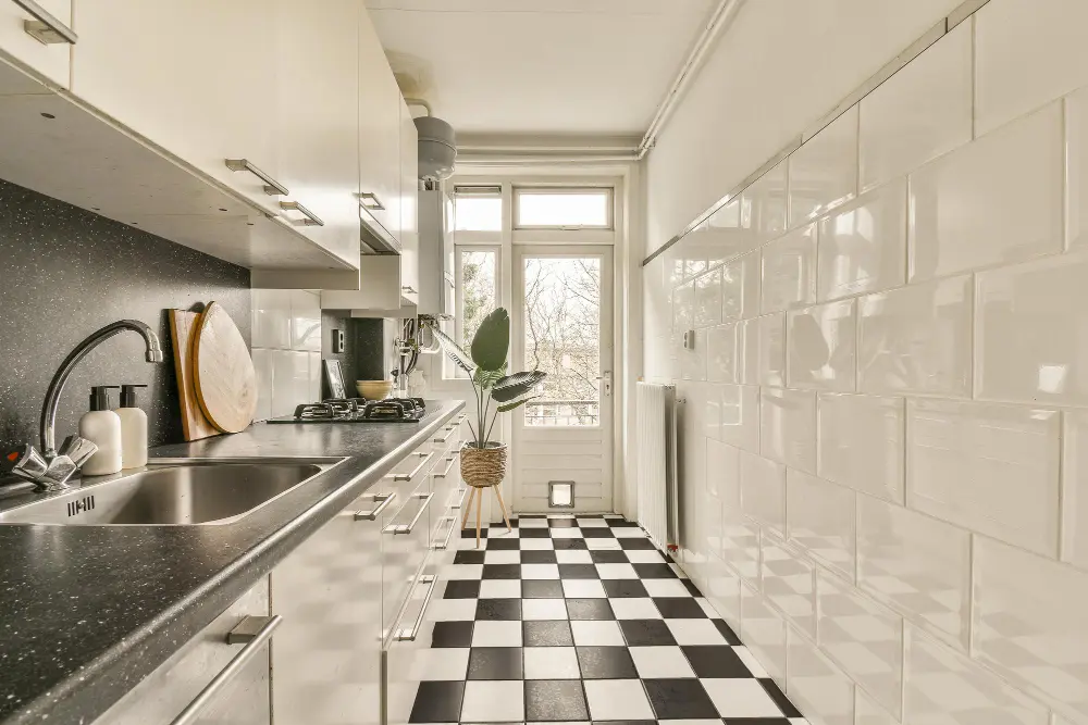 Contemporary kitchen with glossy kitchen wall tiles and durable floor tiling installed by expert kitchen tilers in Melbourne